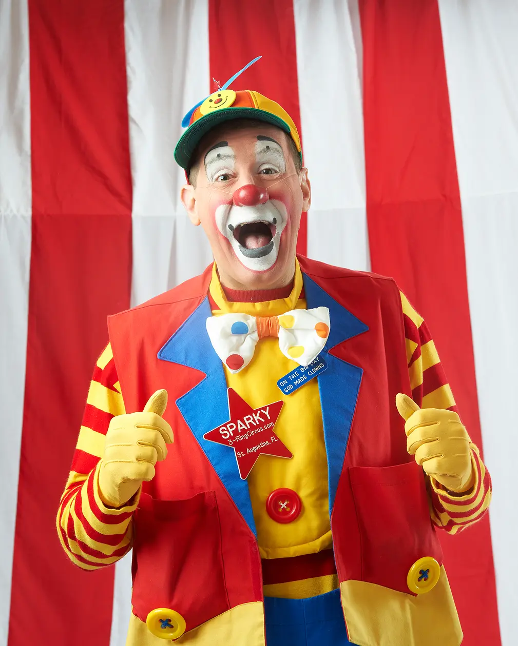 Cheerful clown with bowtie and hat