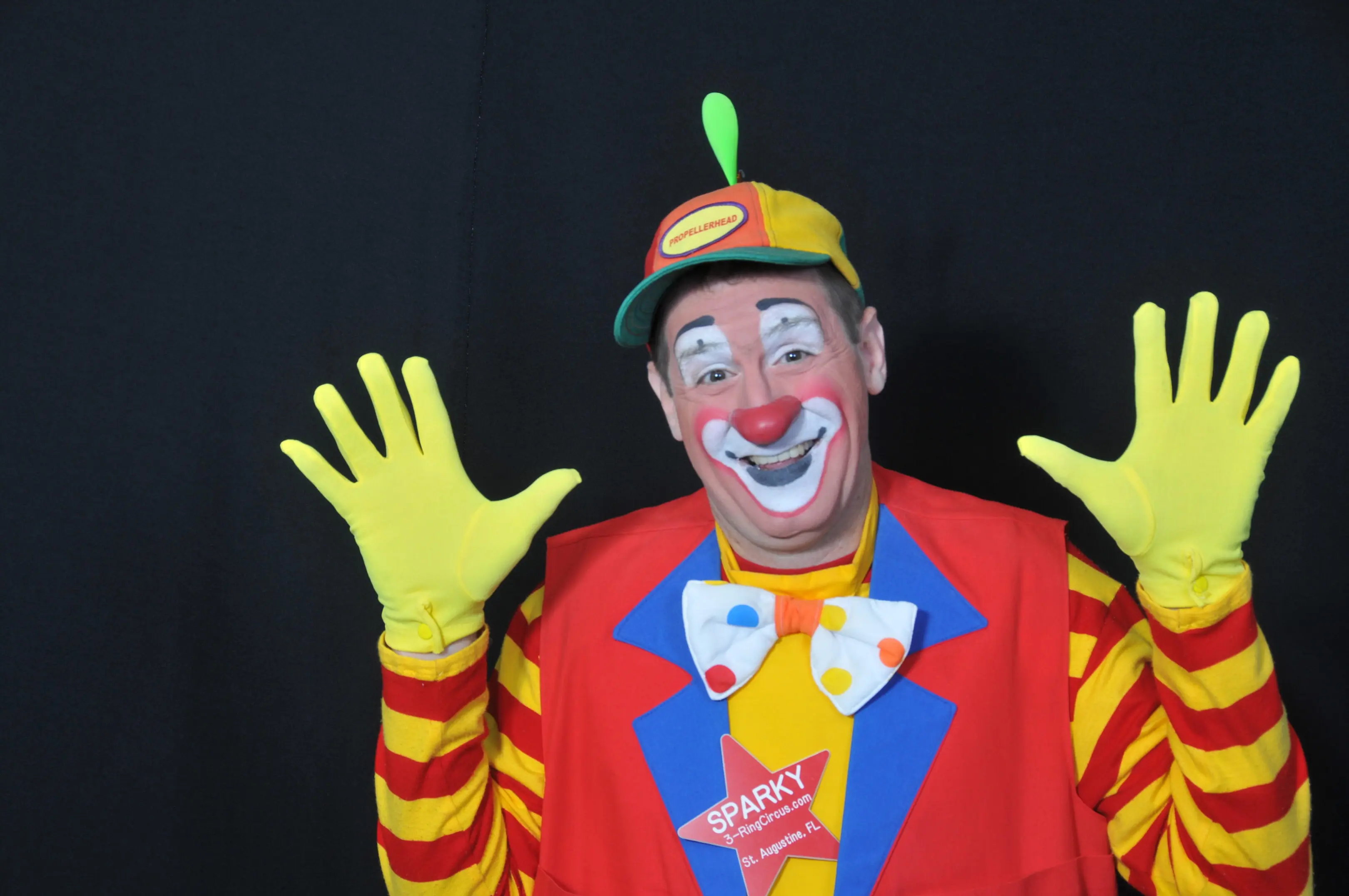 Clown with colorful outfit and big smile