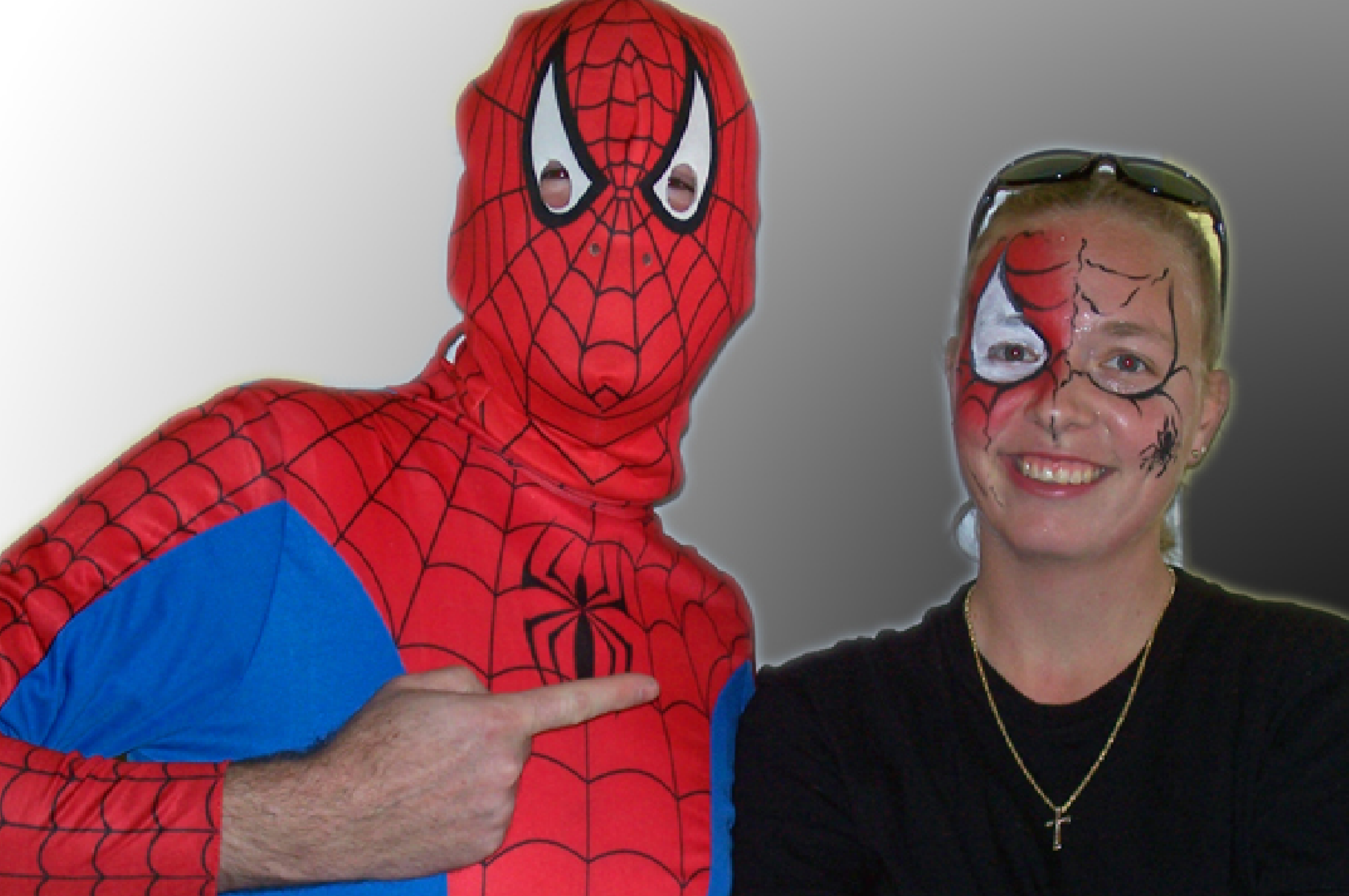 Spider-Man costume with face-painted woman