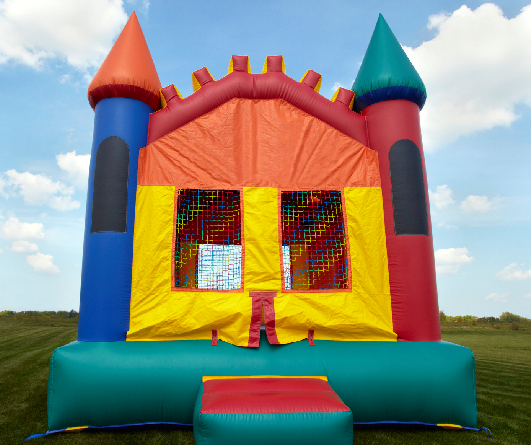 Bright bouncy castle with turrets outdoors